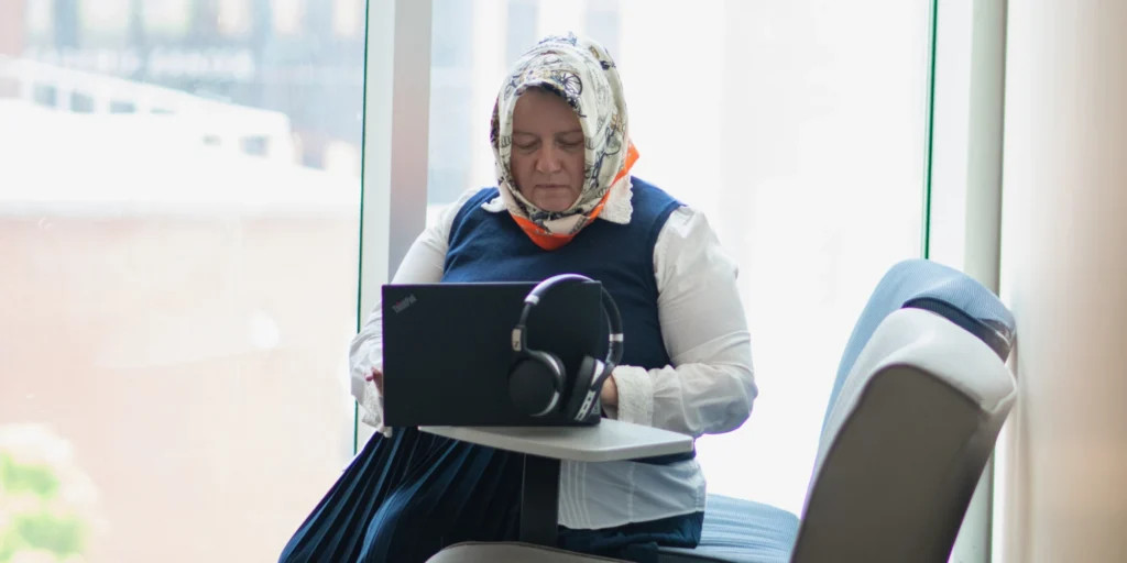 Woman using laptop.